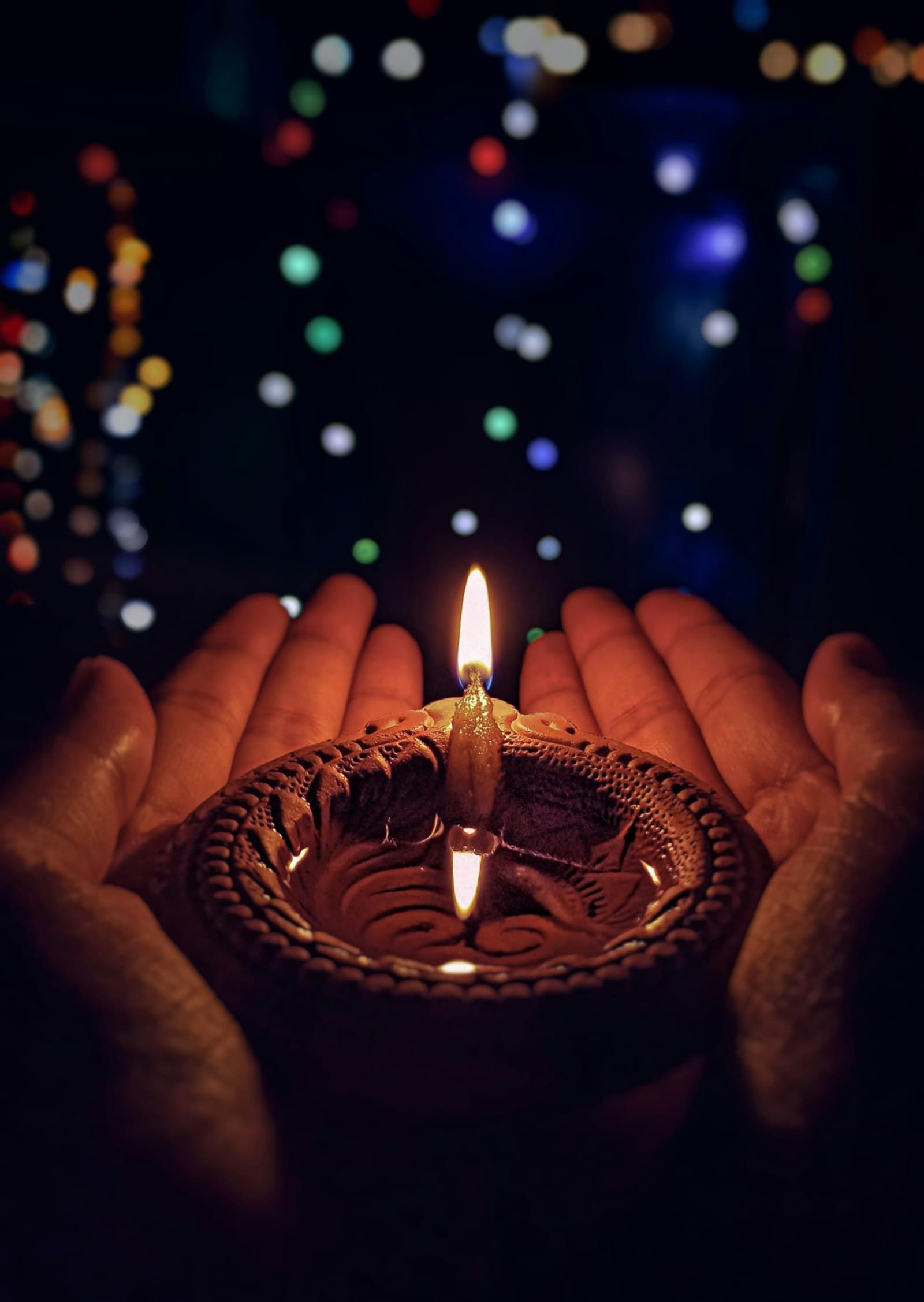 A diya lit for the evening prayer